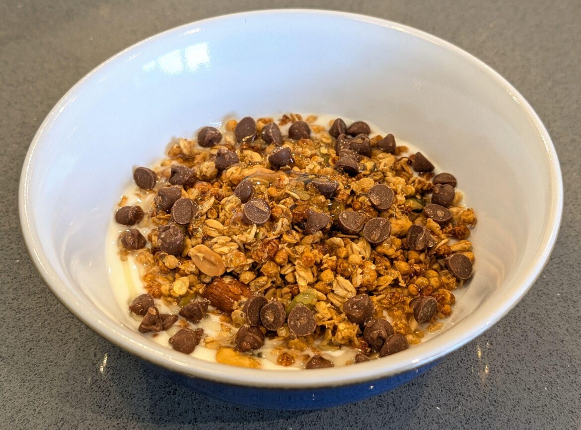 (330 Cal) My comfort food when I'm feeling sad. Low fat yogurt, high-protein granola, choggy chips, & honey :)