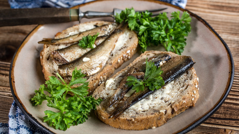 Open faced sardine sandwich with lettuce