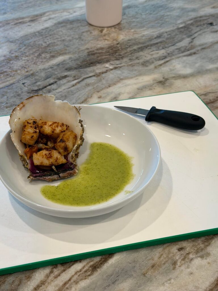 My friend gifted me two locally caught scallops here near Huntington Beach. Fresh. Delicious. I cleaned it then ate it with a green Vietnamese spicy seafood sauce. So good!! Catch clean cook.