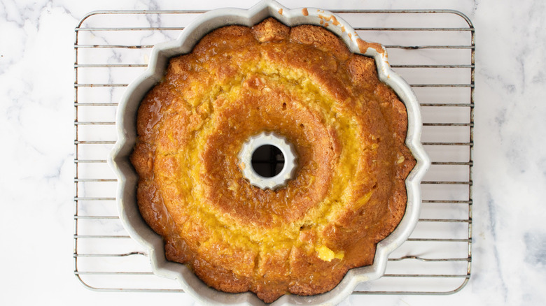 Bundt cake in pan on wire rack