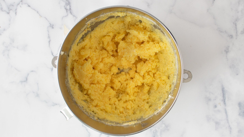 Yellow butter mixture in mixing bowl