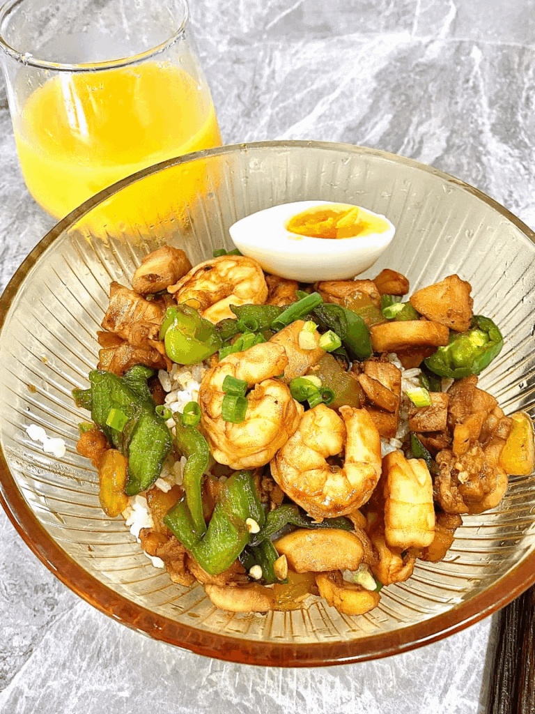 Shrimp and chicken stir-fry with an egg on top? Yeah I'm eating this every day now