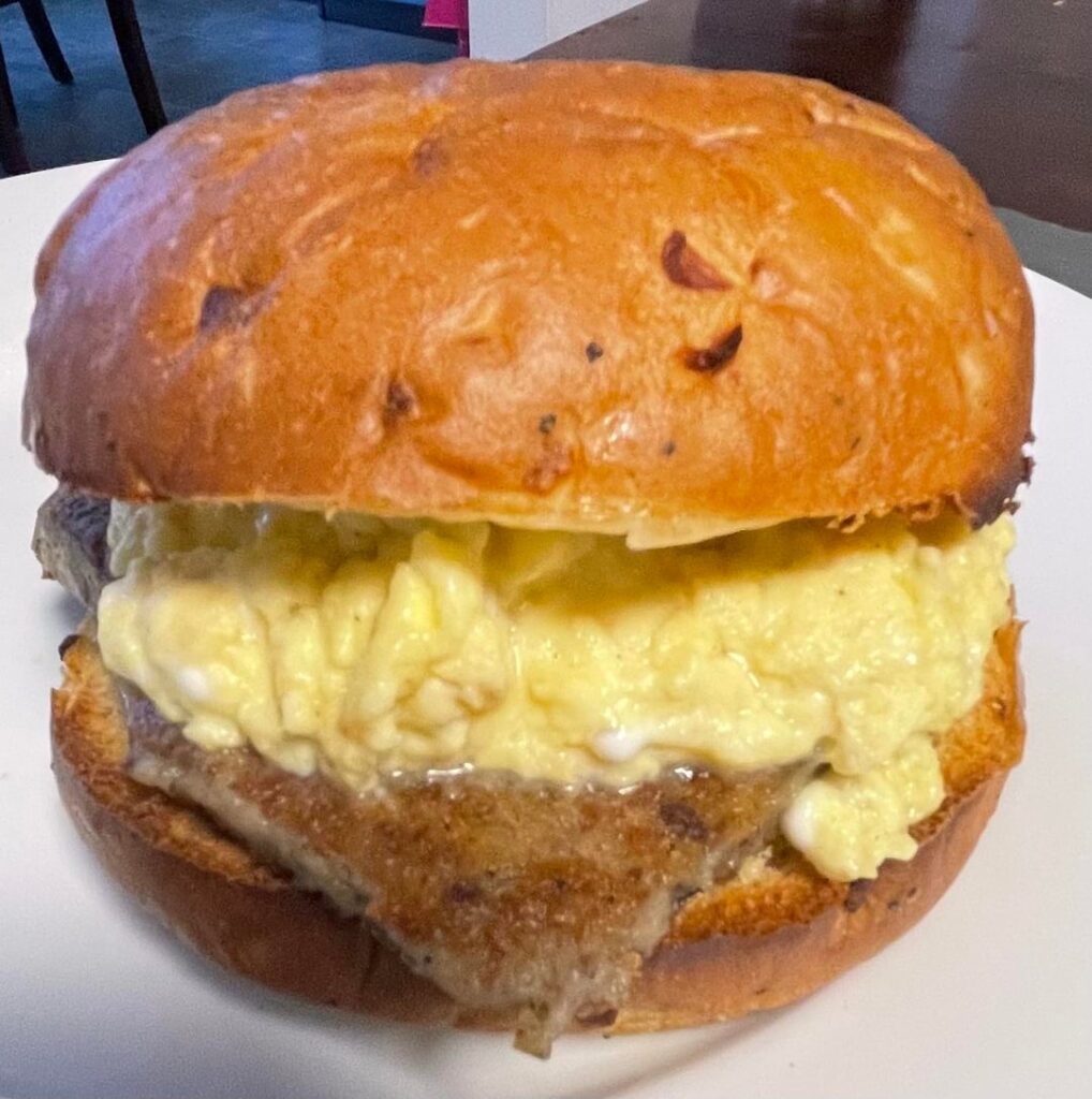 Egg, Scrapple and provolone cheese on a lightly toasted onion roll
