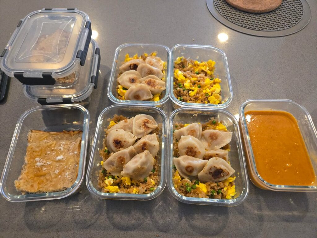 Cauliflower fried rice with dumplings and red curry sauce. "Almond Croissant" Oat Bake