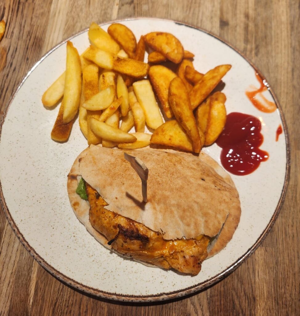 Chicken (grilled) Pitta with some wedges/chips