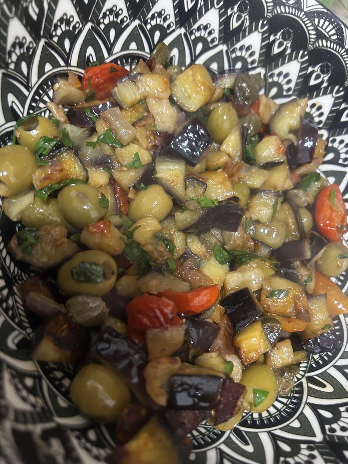 Pan-fried eggplant with cherry tomatoes, olives, and capers!