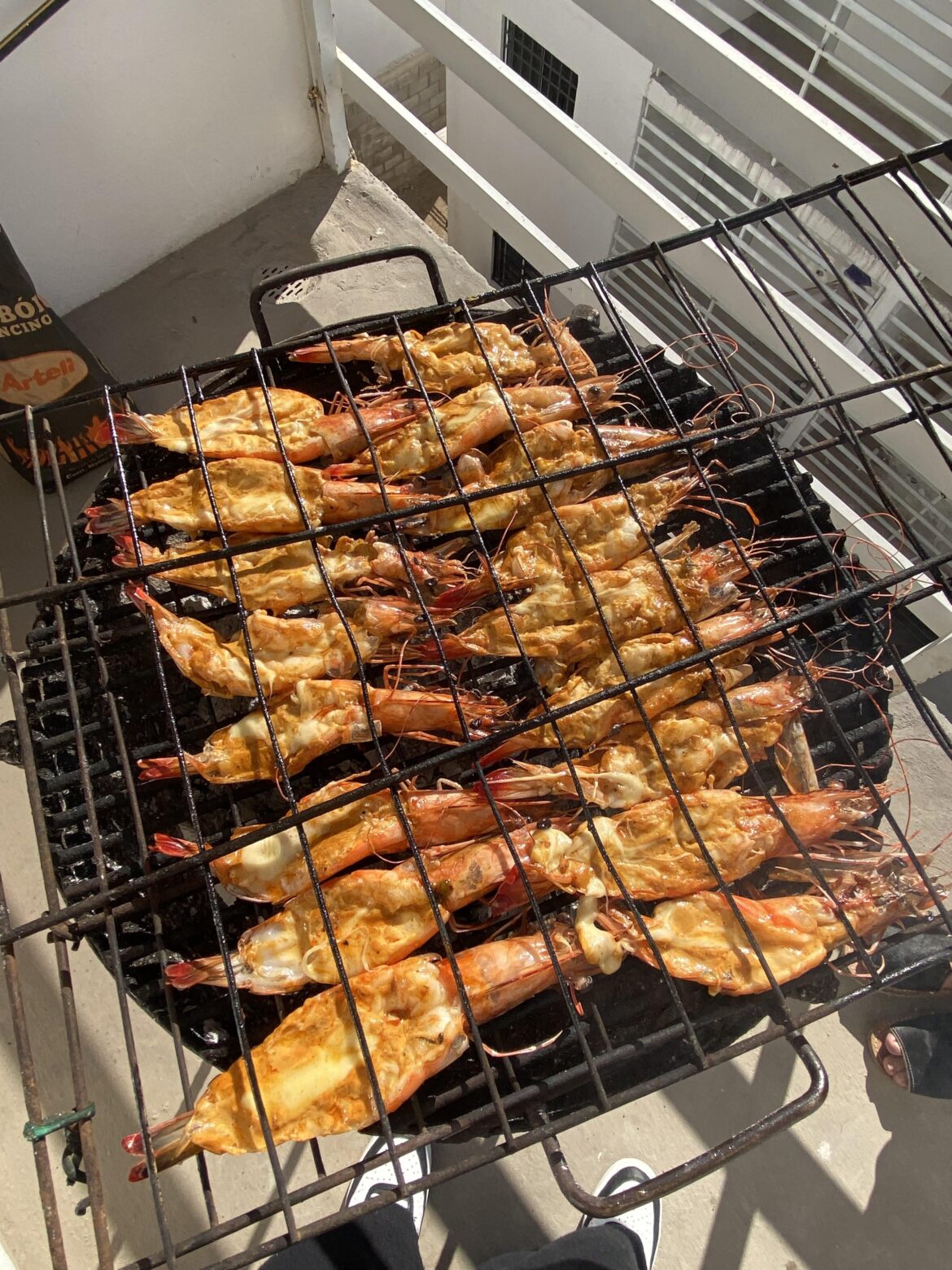 Today I made these grilled shrimp with melted cheese. I recommend seasoning them first and then putting them on the grill to cook. When you turn the racks over, add the cheese after they're cooked. If you do it before, it might all fall off.