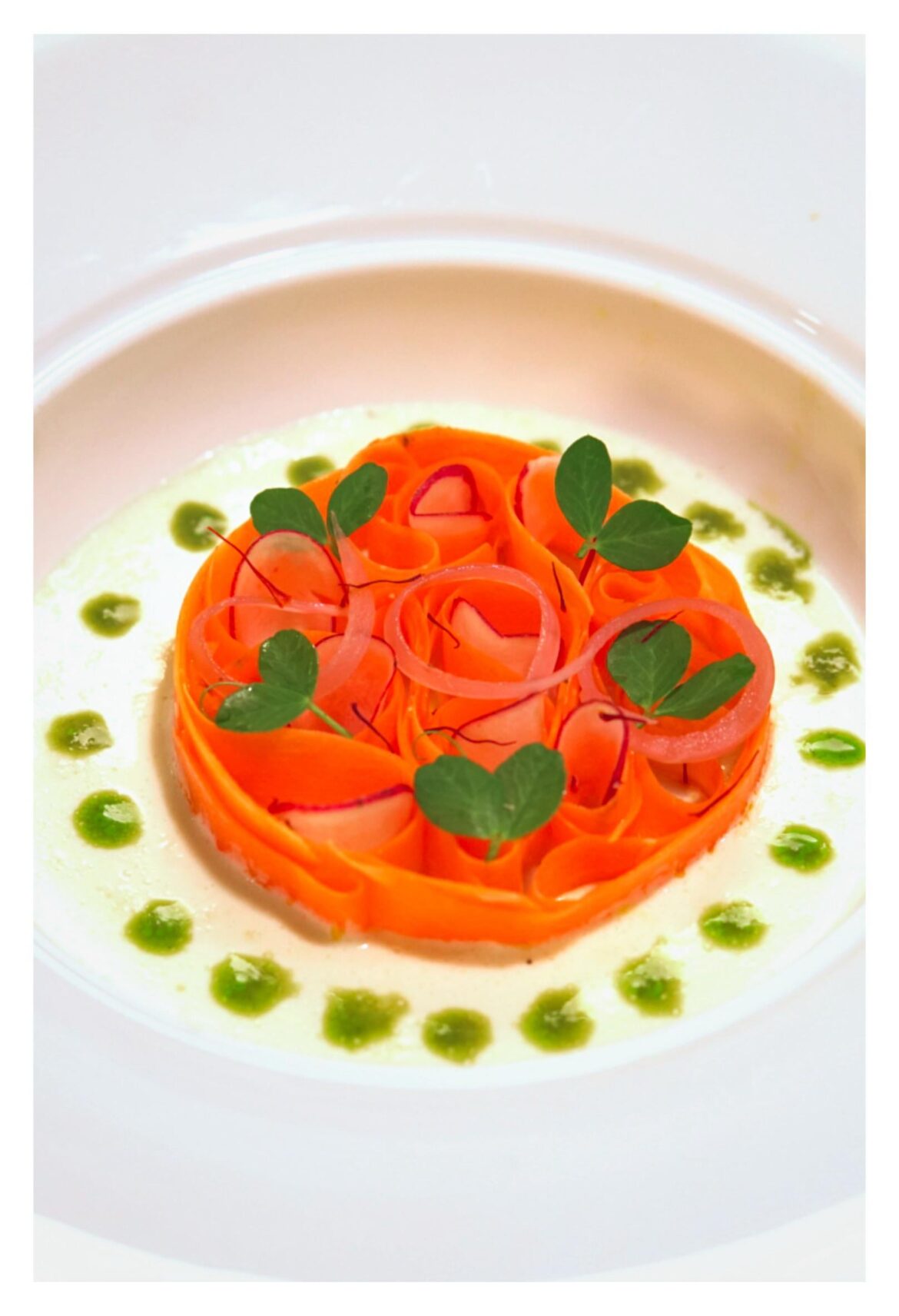 Chili marinated carrot, pickled radish, miso ginger cashew cream, basil oil Chili marinated carrot, pickled radish, miso ginger cashew cream, basil oil