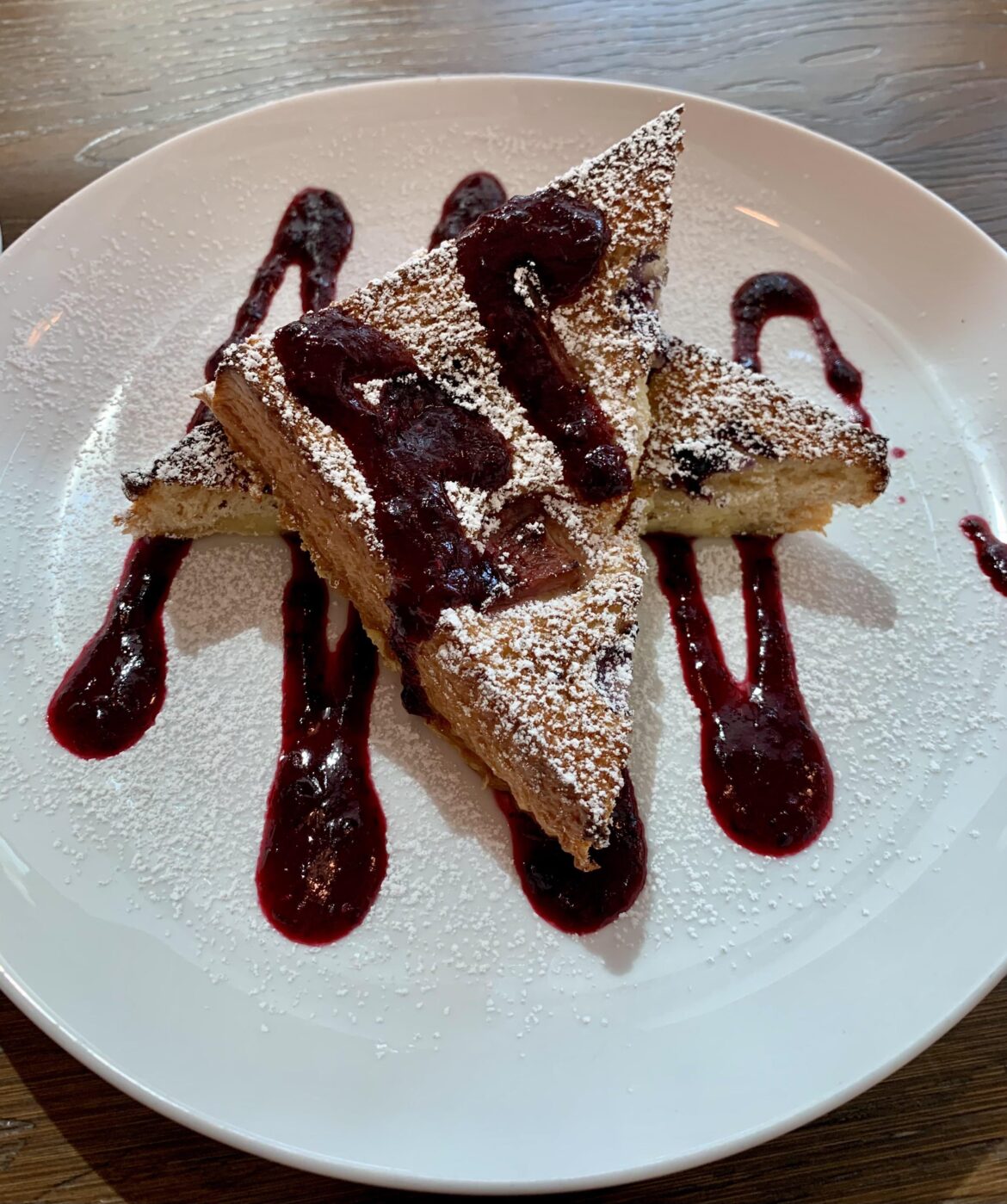 Layered Puff Pastry with Lemon Cream and Berry Compote sprinkled with Powdered Sugar