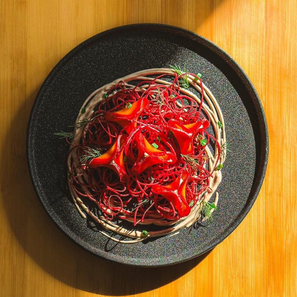 Golden beet dumpling with mascarpone / feta on Beet strings and Balsamic Greek yogurt