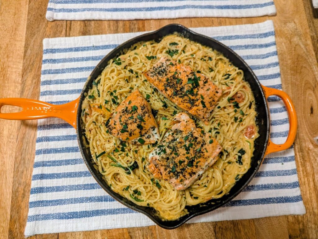 Tuscan spaghetti with pan-seared salmon