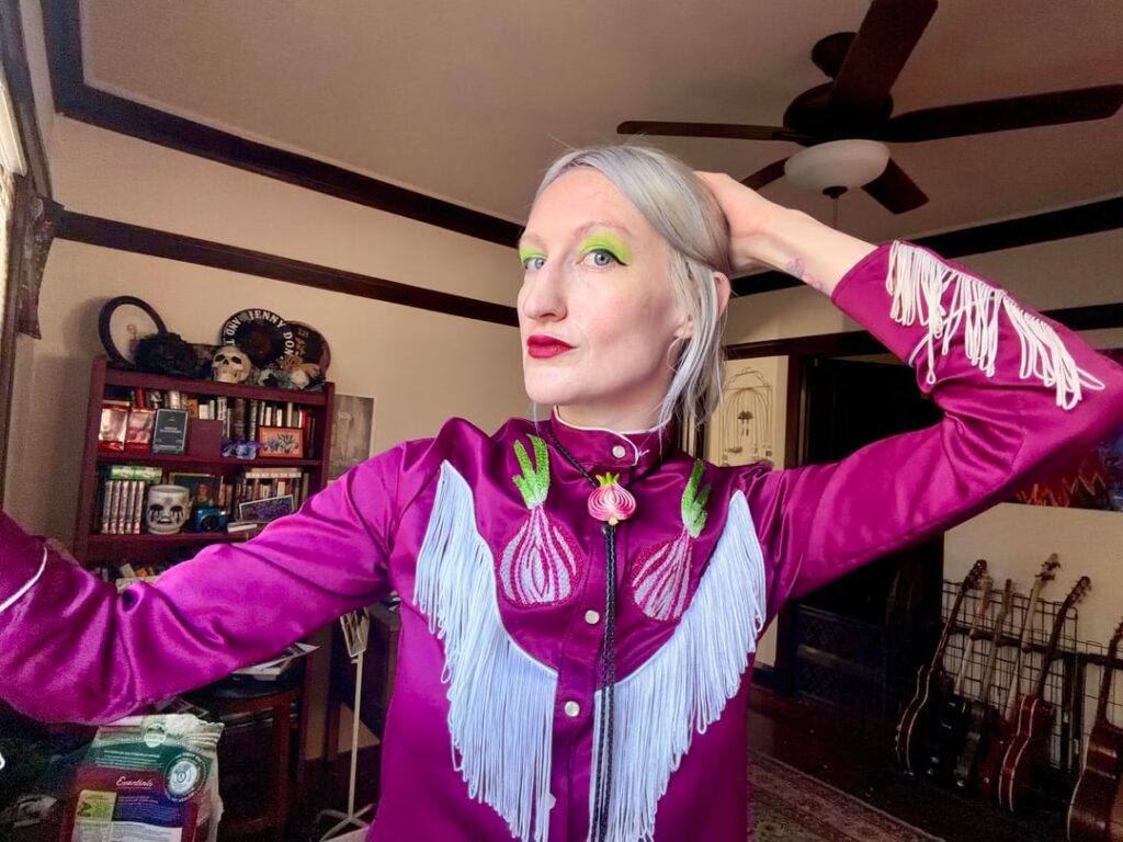 Hand embroidered purple onions onto a vintage western shirt.