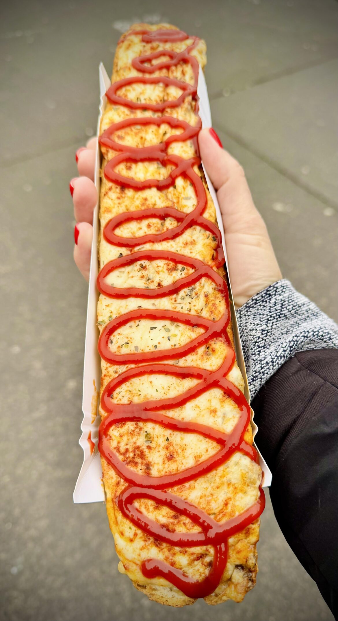 [I ate] a zapiekanka in Poland. French baguette, mushrooms, cheese & ketchup. Kraków’s most iconic street food.