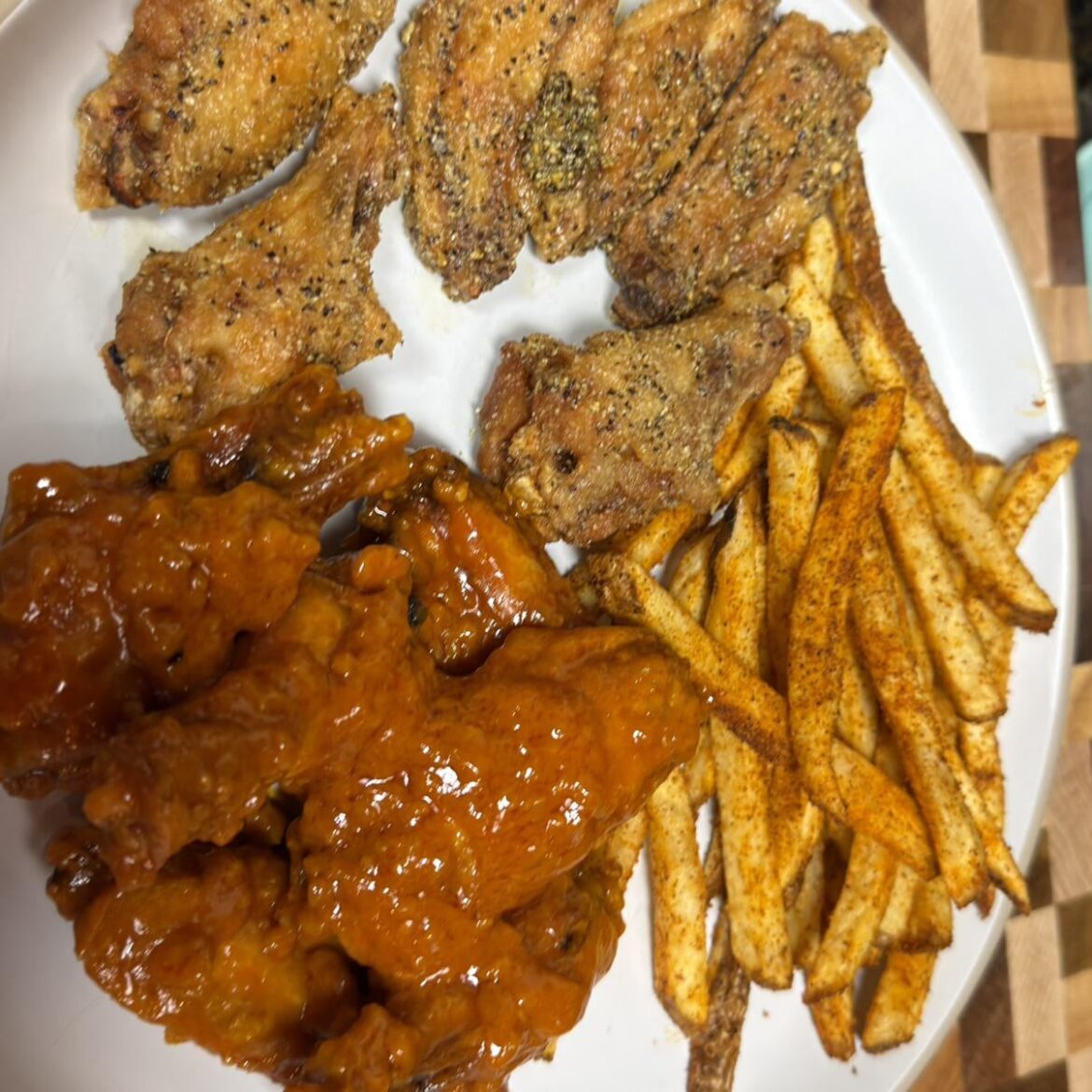 Wing Wednesday at home! Lemon Pepper and Spicy Garlic with Chipotle BBQ seasoned fries