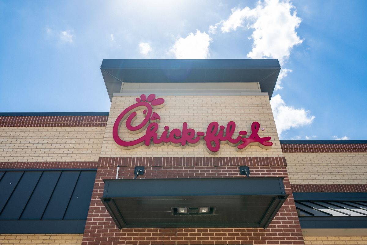 The exterior of Chick-fil-A restaurant in Houston, Texas on a sunny day