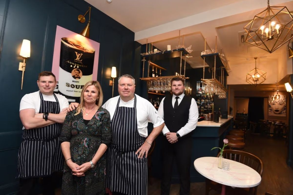 Marc and Michaela Verite( centre) with sons Jacques (left) and Charlie (right)