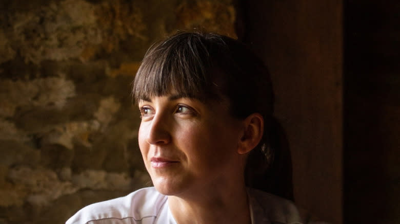 Michelin Star chef Alice Power sitting at table inside The Black Swan at Oldstead