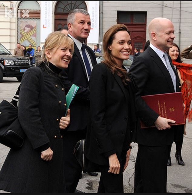 Jolie and Helic (left) grew close in 2012 after she teamed up with his then-boss, former UK foreign secretary William Hague (right), on an anti–sexual violence campaign