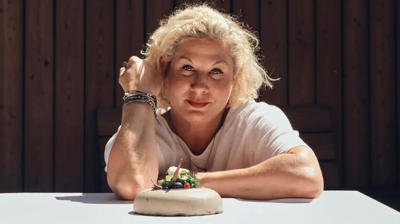 Michelin Star chef Ana Roš Stojan sitting at table with food