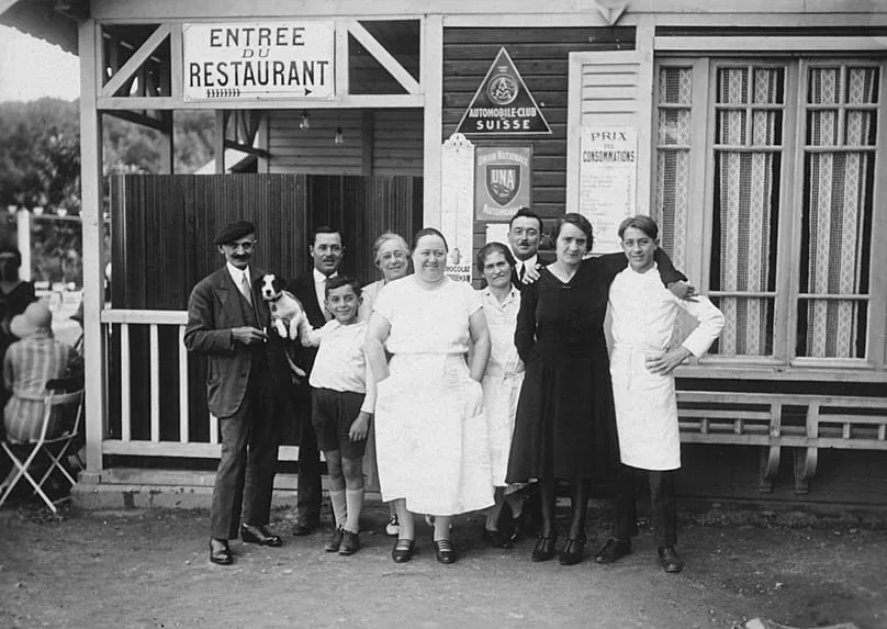 Eugénie Brazier, center, with staff outside her restaurant at Col de la Luère near Lyon.