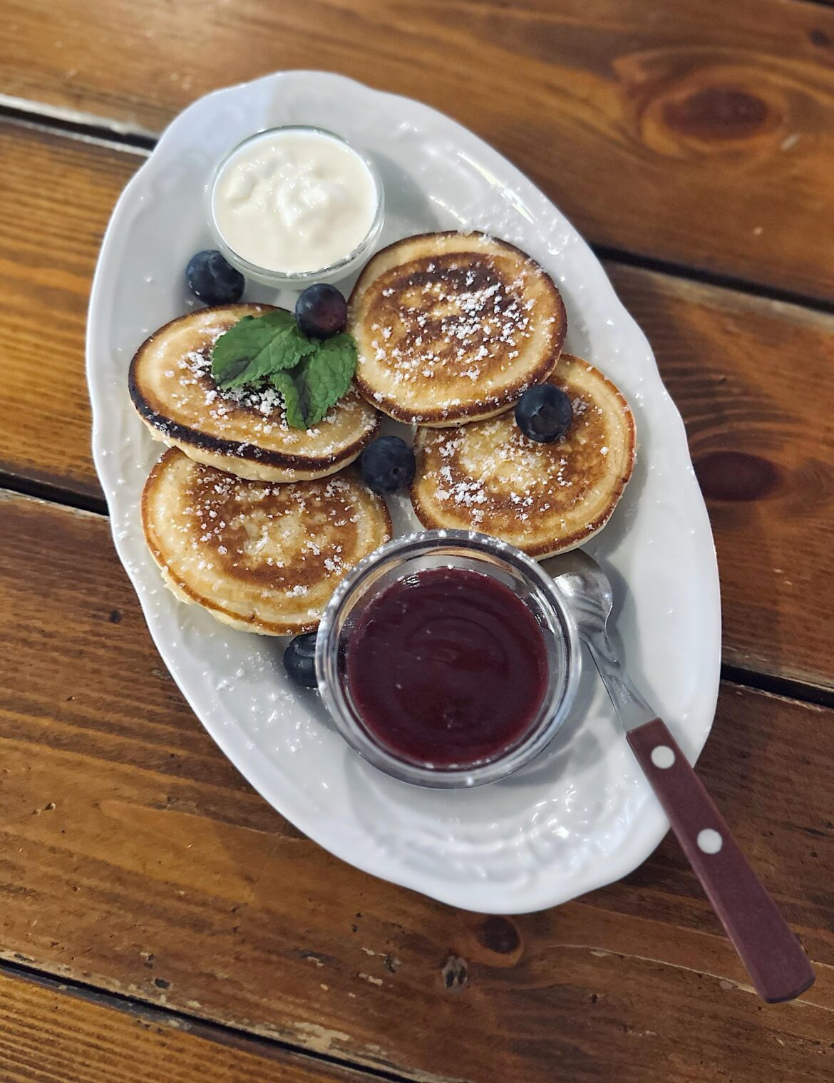 Pancakes with sour cream and lingonberry jam