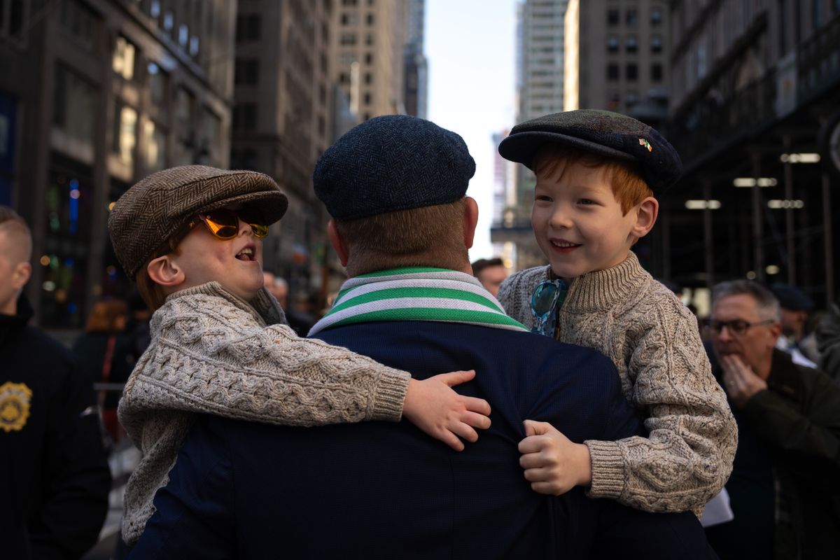 NEW YORK, NEW YORK - MARCH 16: James Byrne holds his sons Quincy Byrne, aged 5, and Tucker Byrne, aged 4, before taking part in the 263rd annual St. Patrick's Day parade on March 16, 2024 in New York City. The first New York City Saint Patrick's Day Parade parade was held on March 17, 1762, fourteen years before the signing of the Declaration of Independence. 