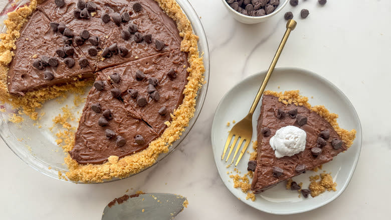 Slice of chocolate pudding pie served onto plate