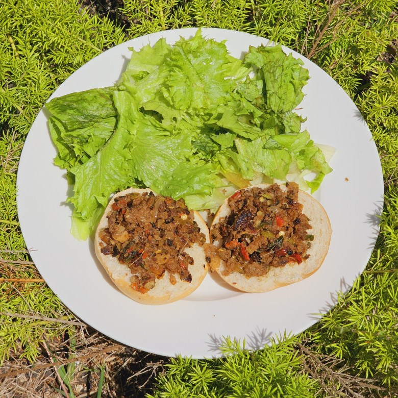 A dish made of Chiquetaille smoked herring. Chiktay Aransò, served on plain bread with lettuce as a side.  Photo by Guethshina Altena/The Haitian Times.