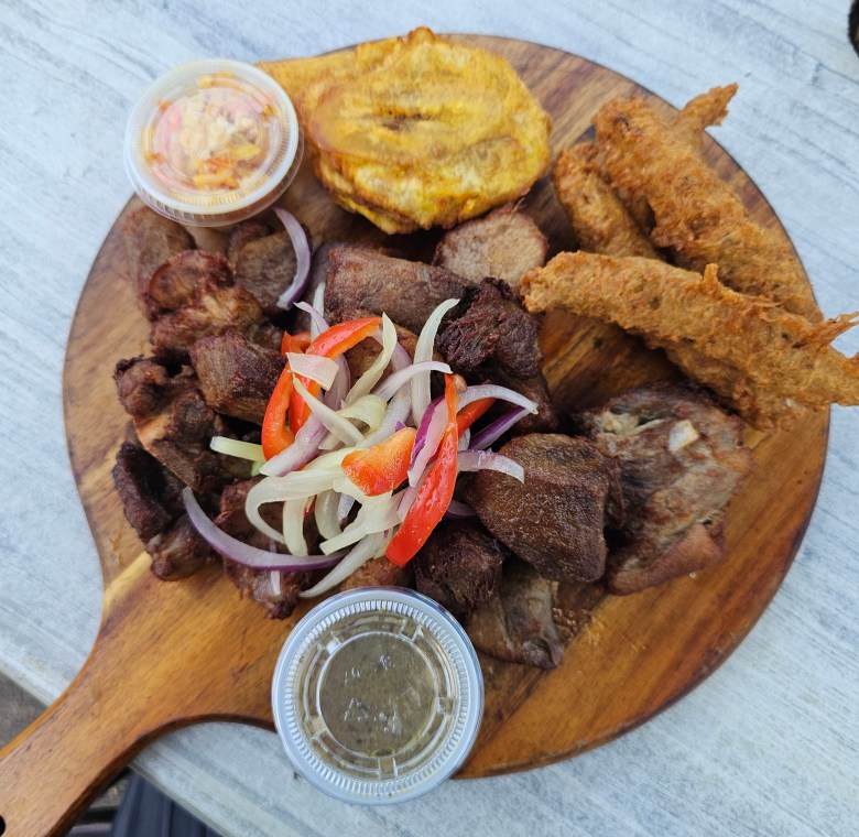 A plate of Haitian Fritay, which includes pieces of marinated meat, Tassot. Photo by Guethshina Altena/The Haitian Times.

