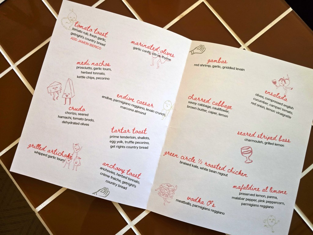 a menu on brown tile