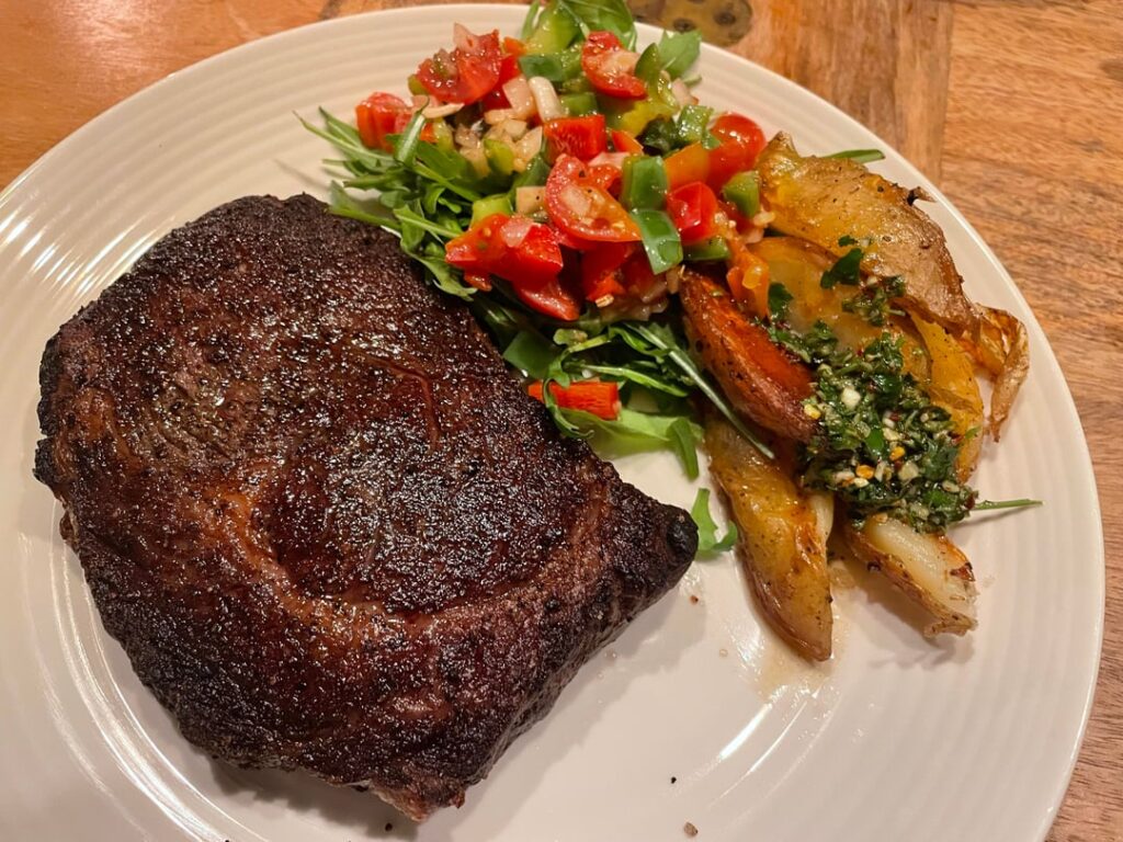 UK Costco Ribeye. Chimichurri wedges on the side.