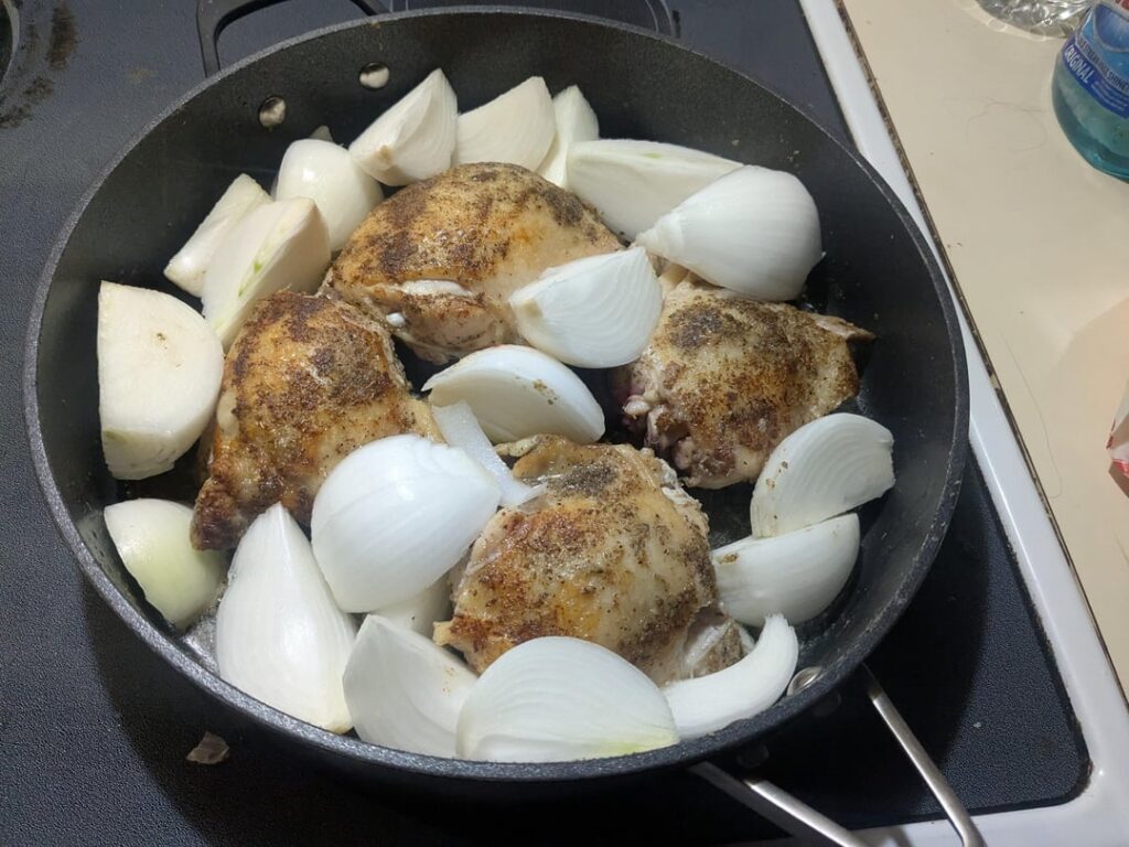 Chicken Thighs, lots of quartered white onions, greek seasoning and olive oil. This is one of my fav things to eat.