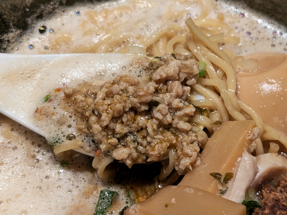 Beneath the toppings lies a surprise portion of boldly flavoured chicken mince. — Picture by Ethan Lau