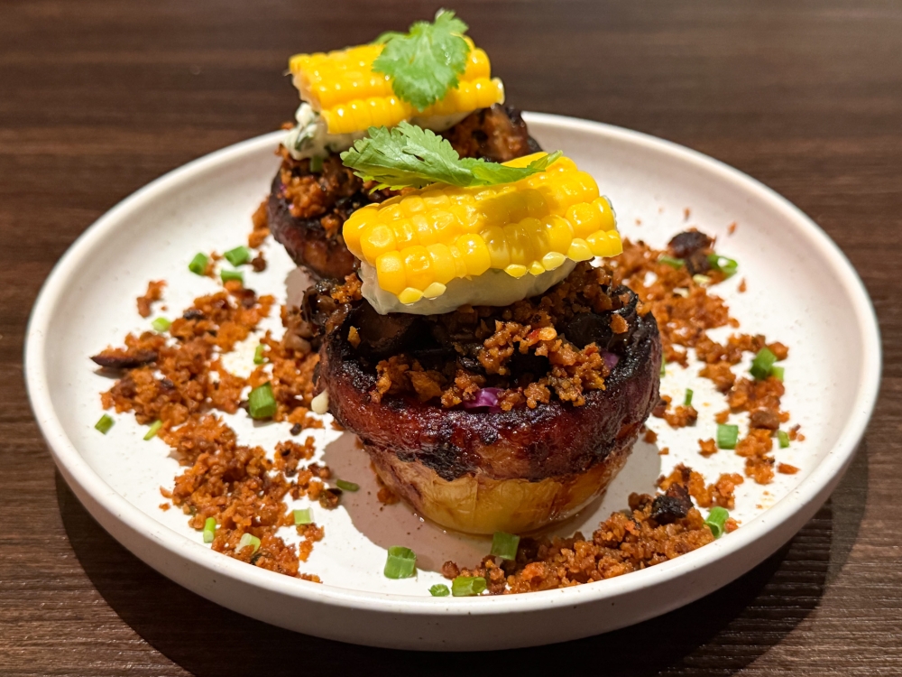 Kumpir, a popular Turkish street food, is the ultimate potato mash-up with varying textures from crispy skin, creamy mashed potatoes layered with sour cream, cabbage slaw and corn. — Picture by Lee Khang Yi
