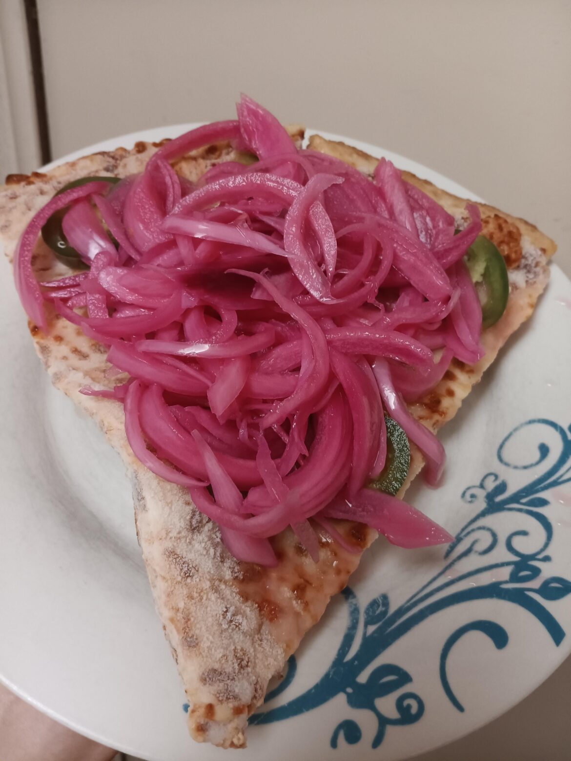 This many pickled red onions on my Costco pizza