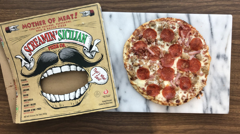 Screamin' Sicilian Mother of Meat! pizza on cutting board.