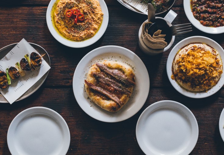 Flatbreads and skewers from AGORA, a great spot for walk-in dining. © Gilles Draps