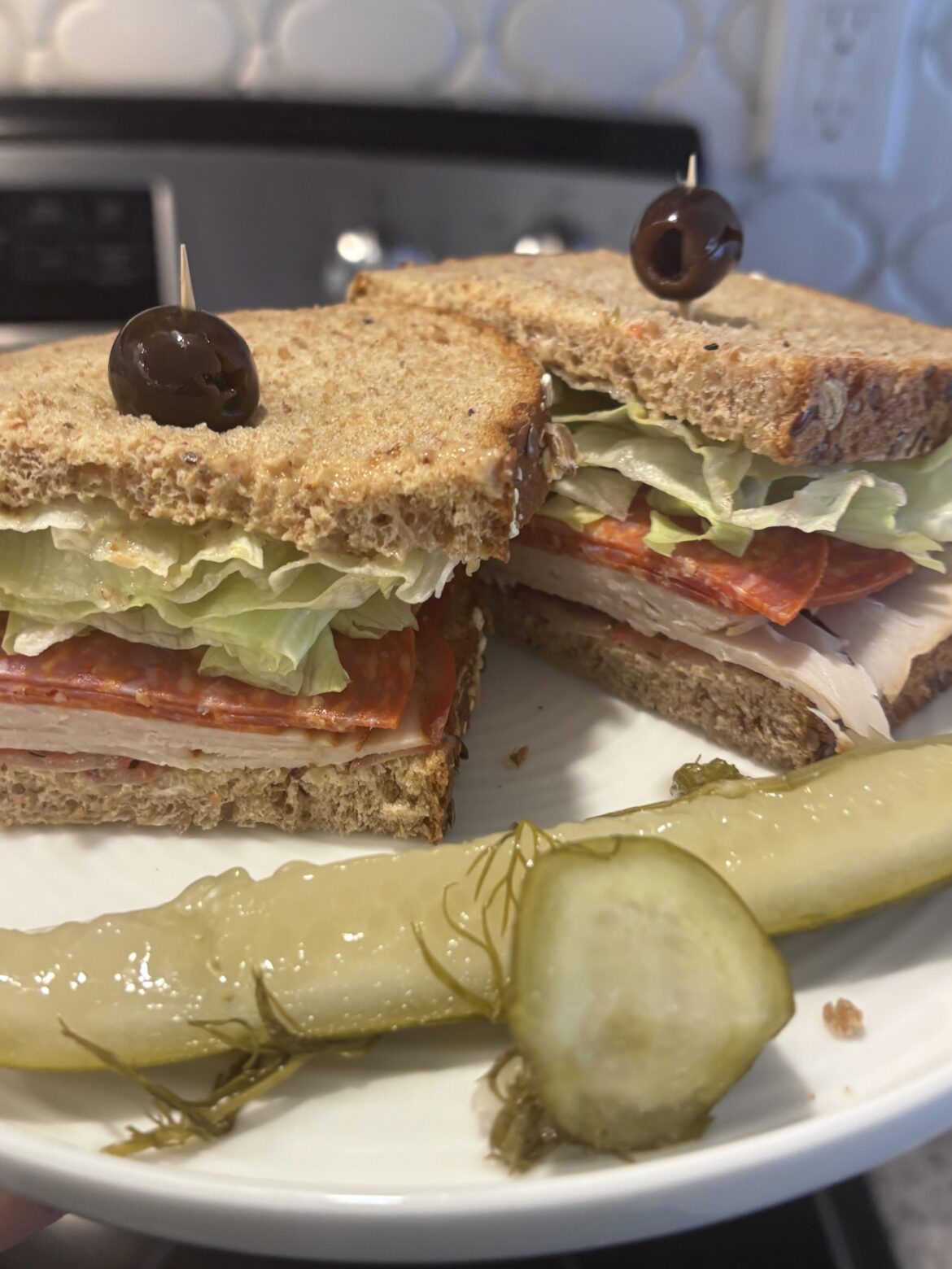 Turkey, pepperoni, mustard, mayo, lettuce, tomato, cracked black pepper and oregano!