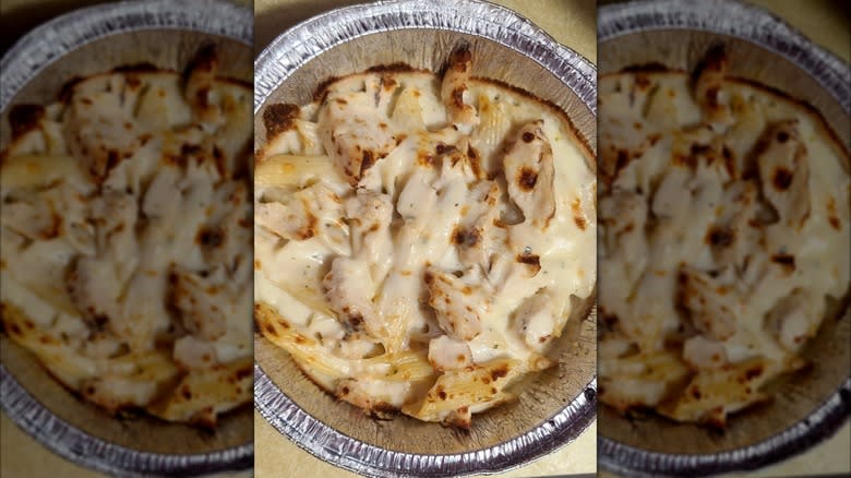 Domino's Chicken Alfredo Pasta in a foil takeout tray