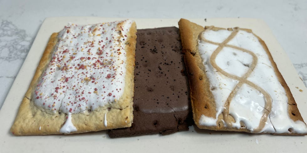 A plate with three different flavored pop tarts.