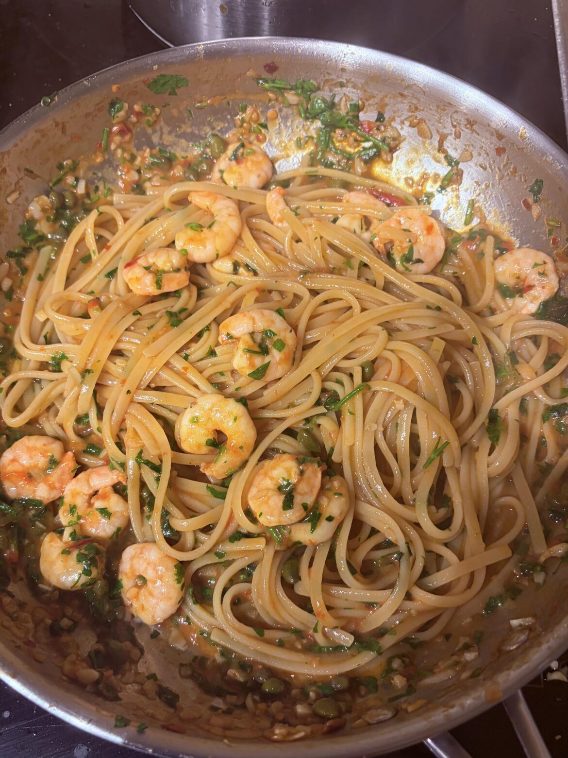 Linguine with scampi, fresh tomato, capers, garlic and parsley
