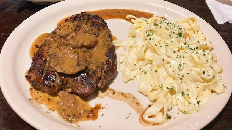 A plate of steak and pasta at Carrabba's Italian Grill