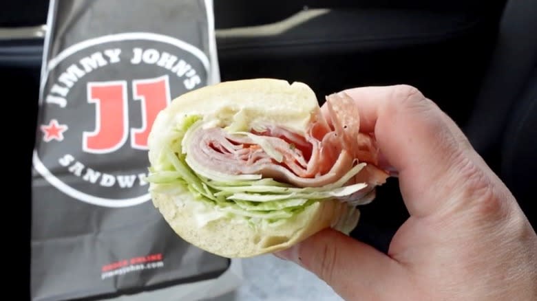 A hand holds up an Italian Night Club from Jimmy John's