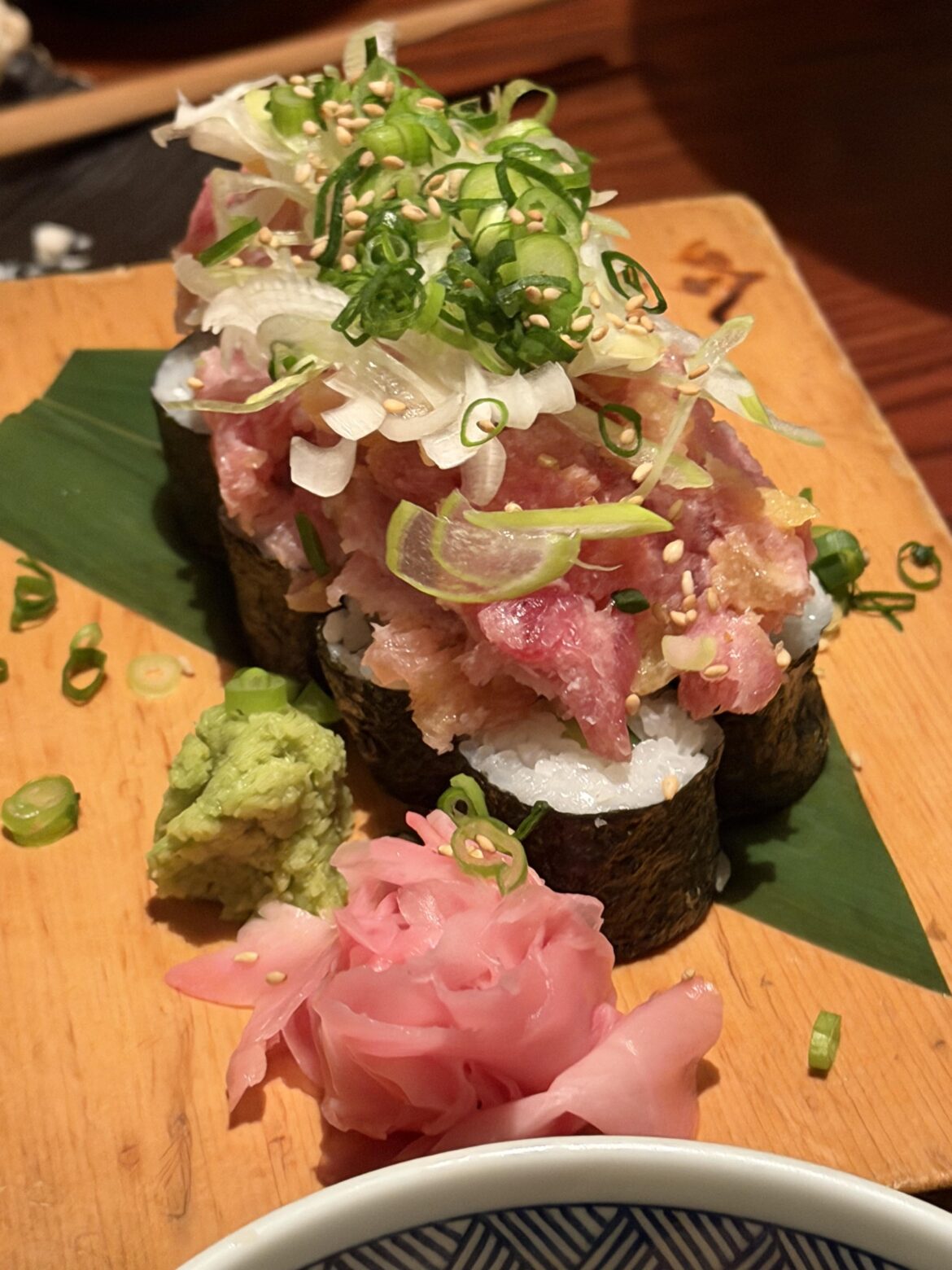 Torotaku Nokke Sushi(Minced fatty tuna (negitoro) on top of a takuan hosomaki (pickled daikon roll)