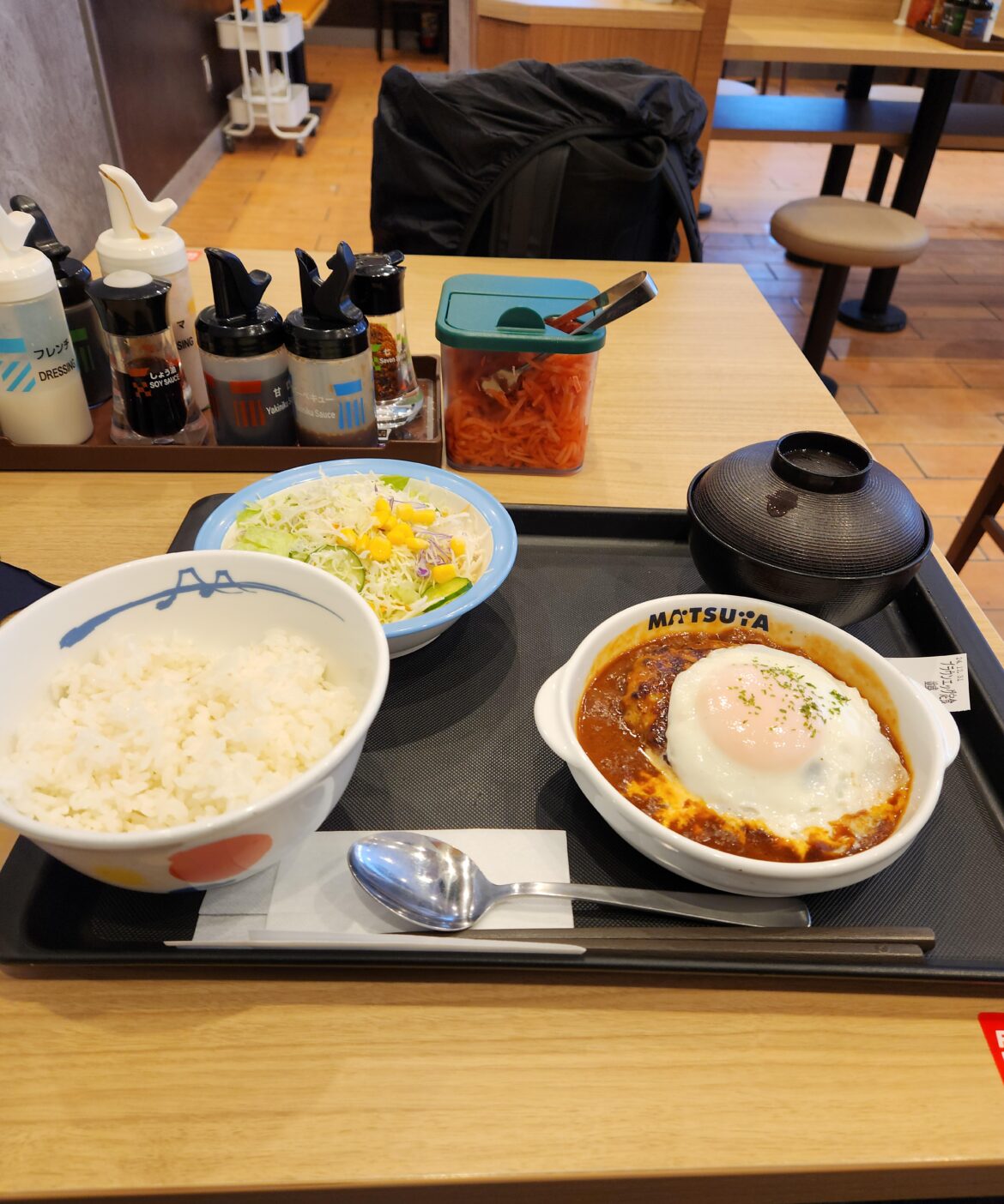 Matsuya hamburger steak with egg and tomato sauce.
