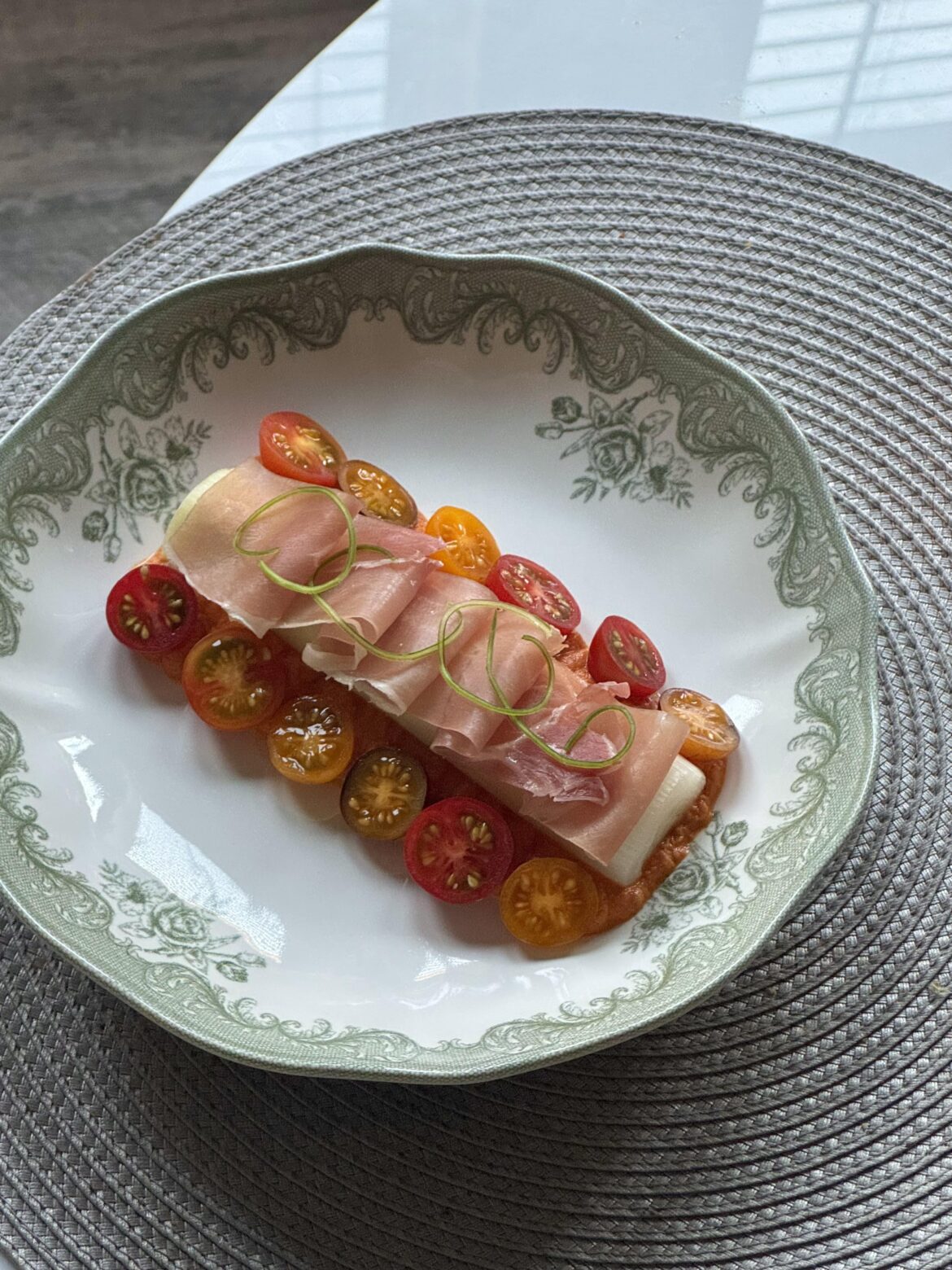 Roasted leek, prosciutto, romesco sauce, cherry tomatoes