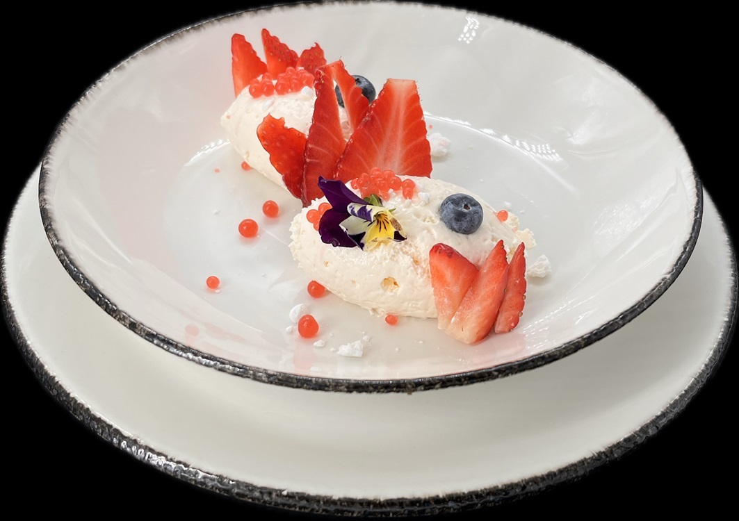 Fruit mousse with fresh strawberries, aromatic pearls, and edible flowers. © Restoran 27