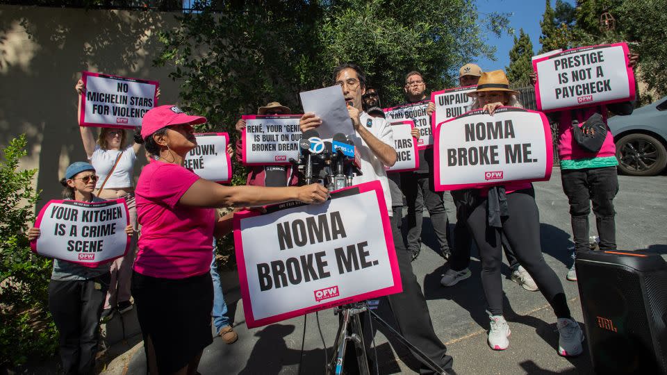 Activists and restaurant workers gather in front of the Noma Los Angeles pop-up in March 2026. - Apu Gomes/AFP/Getty Images