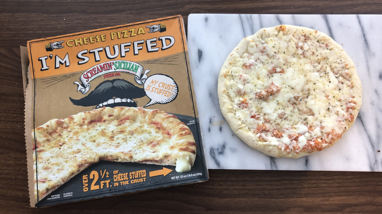 Screamin' Sicilian stuffed cheese pizza on cutting board.