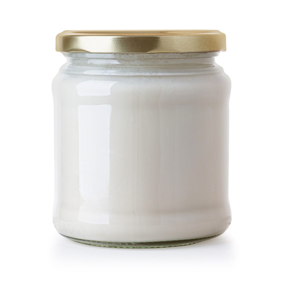 glass jar of milk cream isolated on white with clipping path